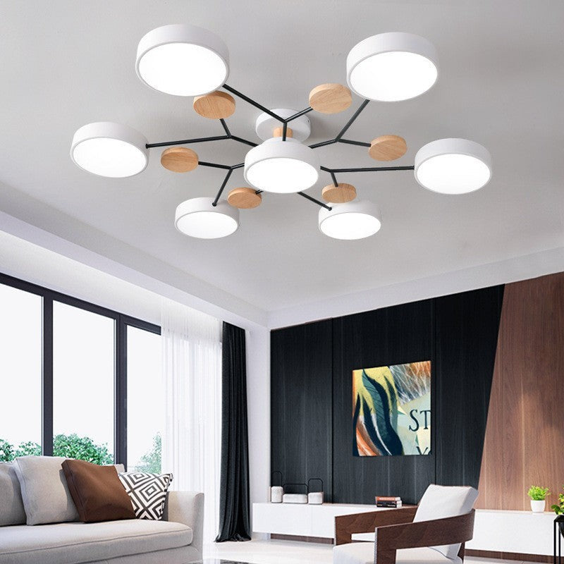 Elvara plafondlamp in groen van ijzer, acryl, hout – in een woonkamer