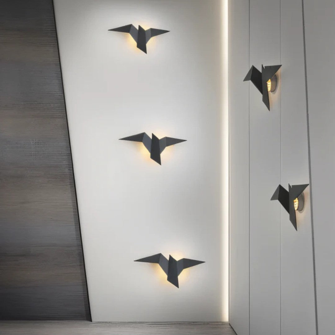 Jelva wandlamp in goud van metaal – in een woonkamer