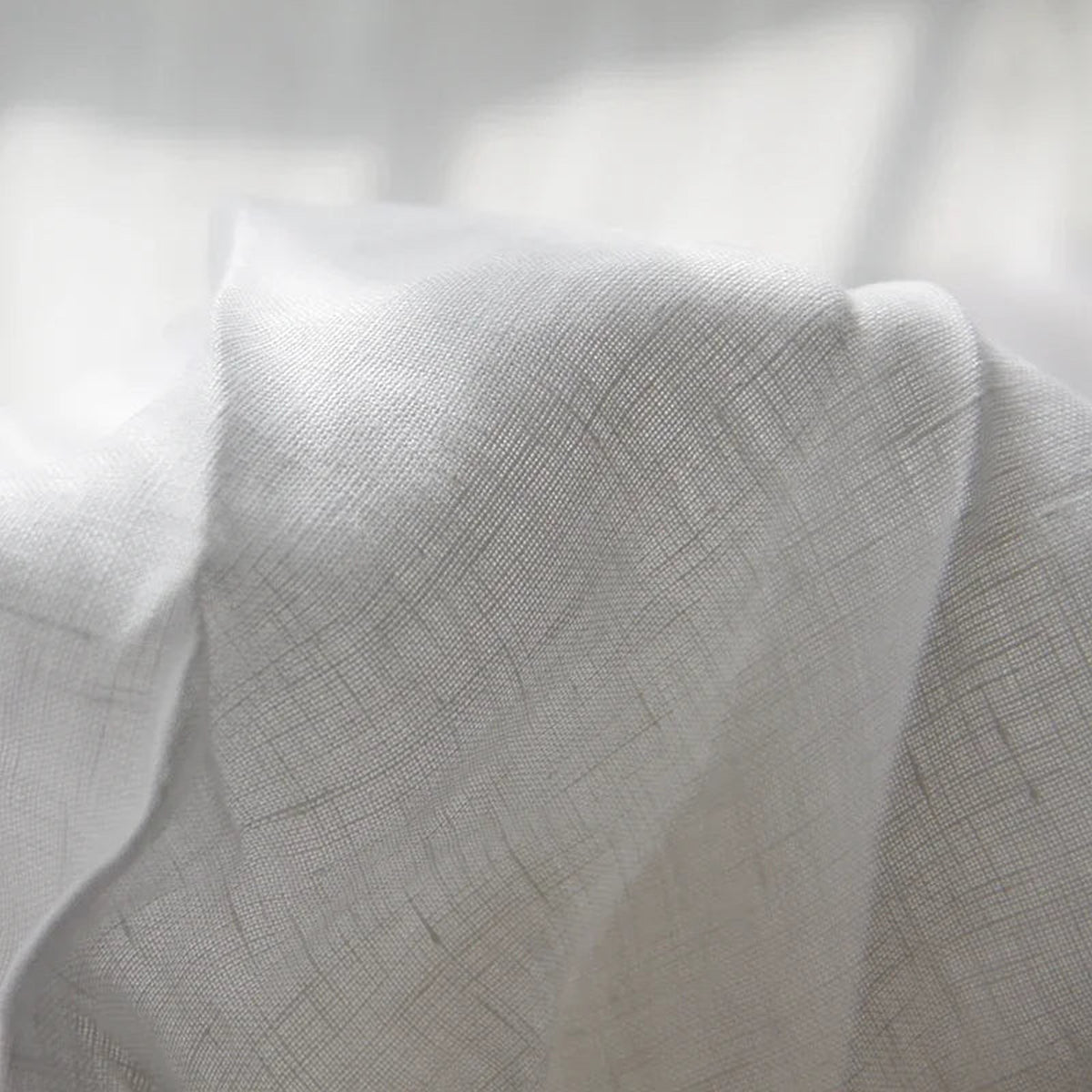 beddengoed in wit – detail van de rand