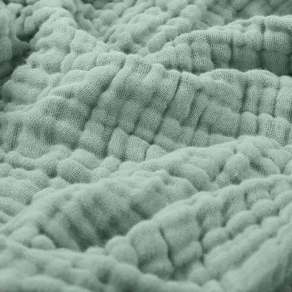 Kolstad plaid in groen van katoen – in een woonkamer